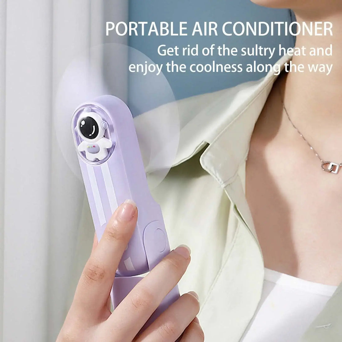 Mini purple portable fan with battery operation and three-speed adjustment, ideal for personal use.
