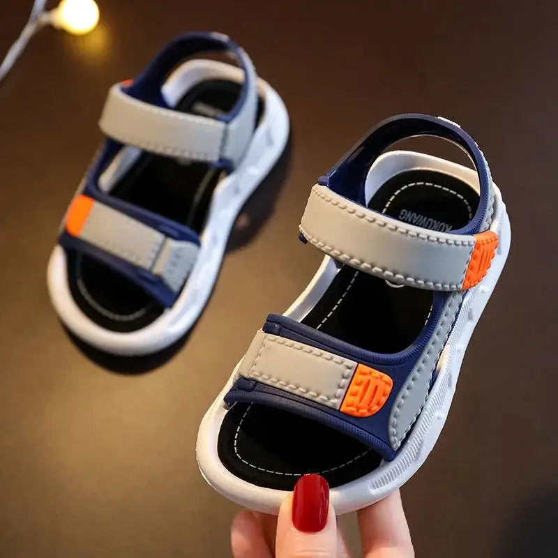 Solid color summer baby sandals for boys and girls, featuring a hook & loop closure and quick-dry material.